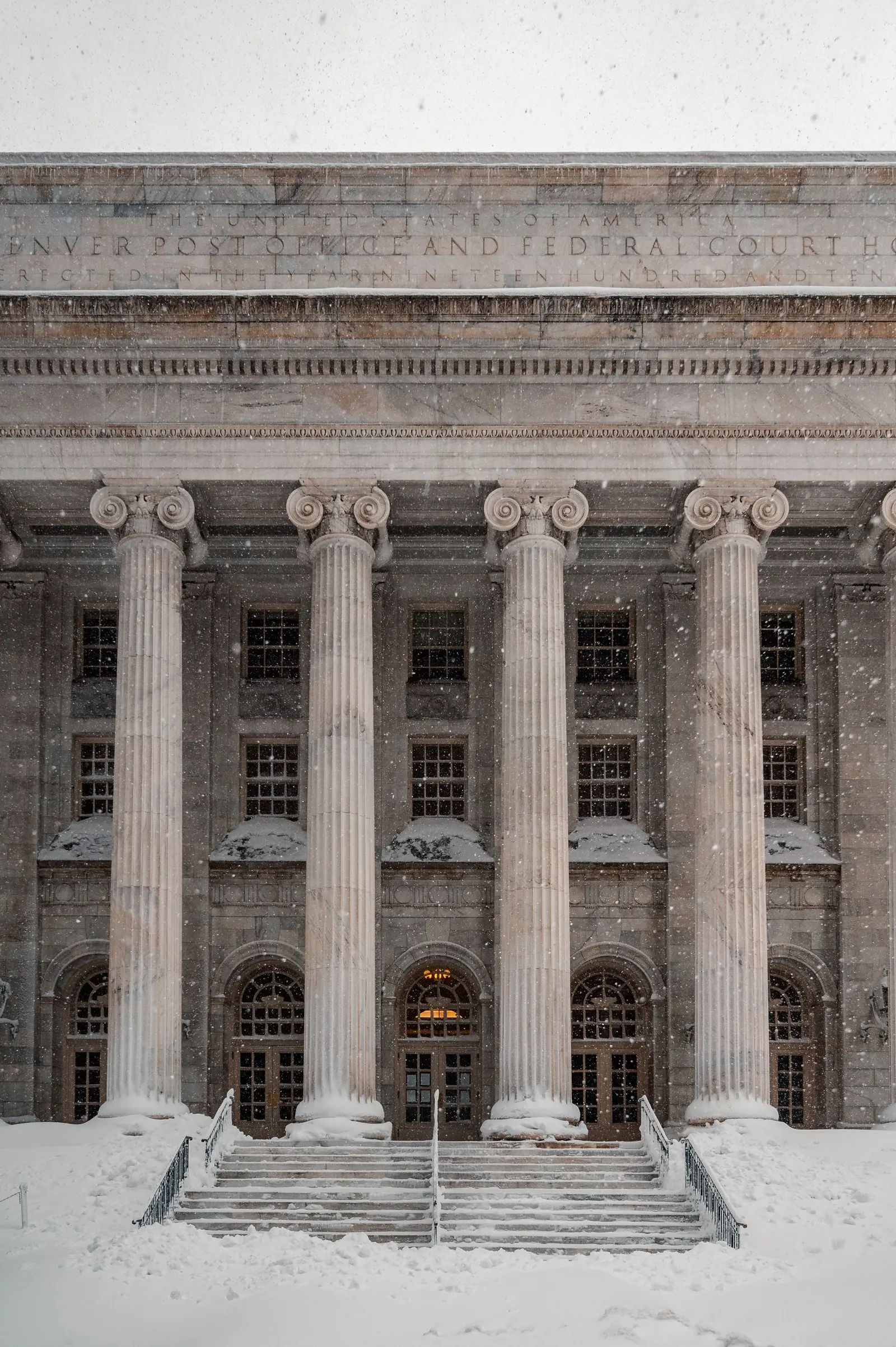 Stone columns along a civic building facade
