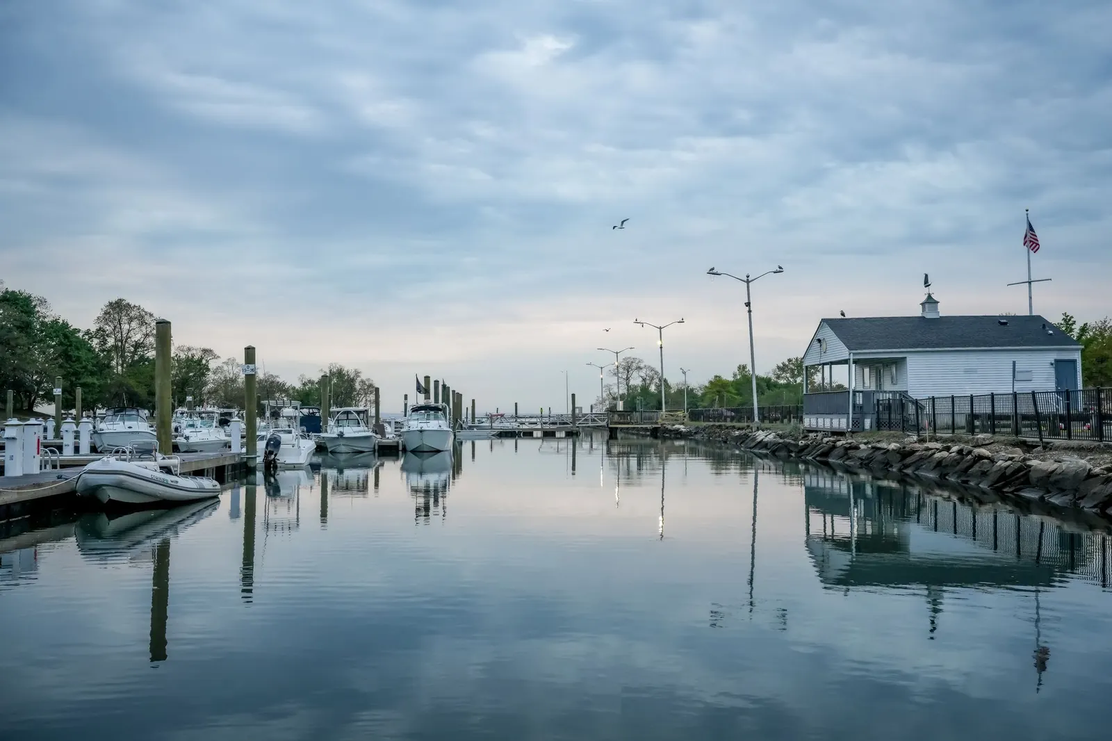 Moored boats resting in a harbour at first light