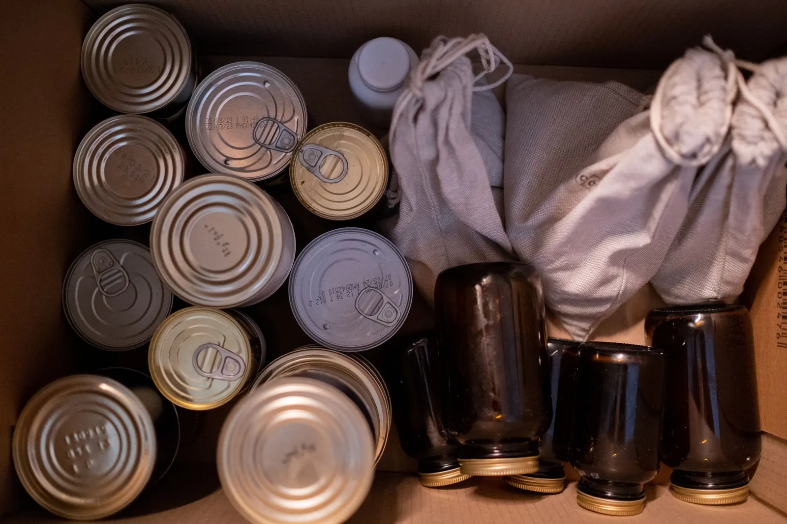 A donation box packed with tinned food and staples