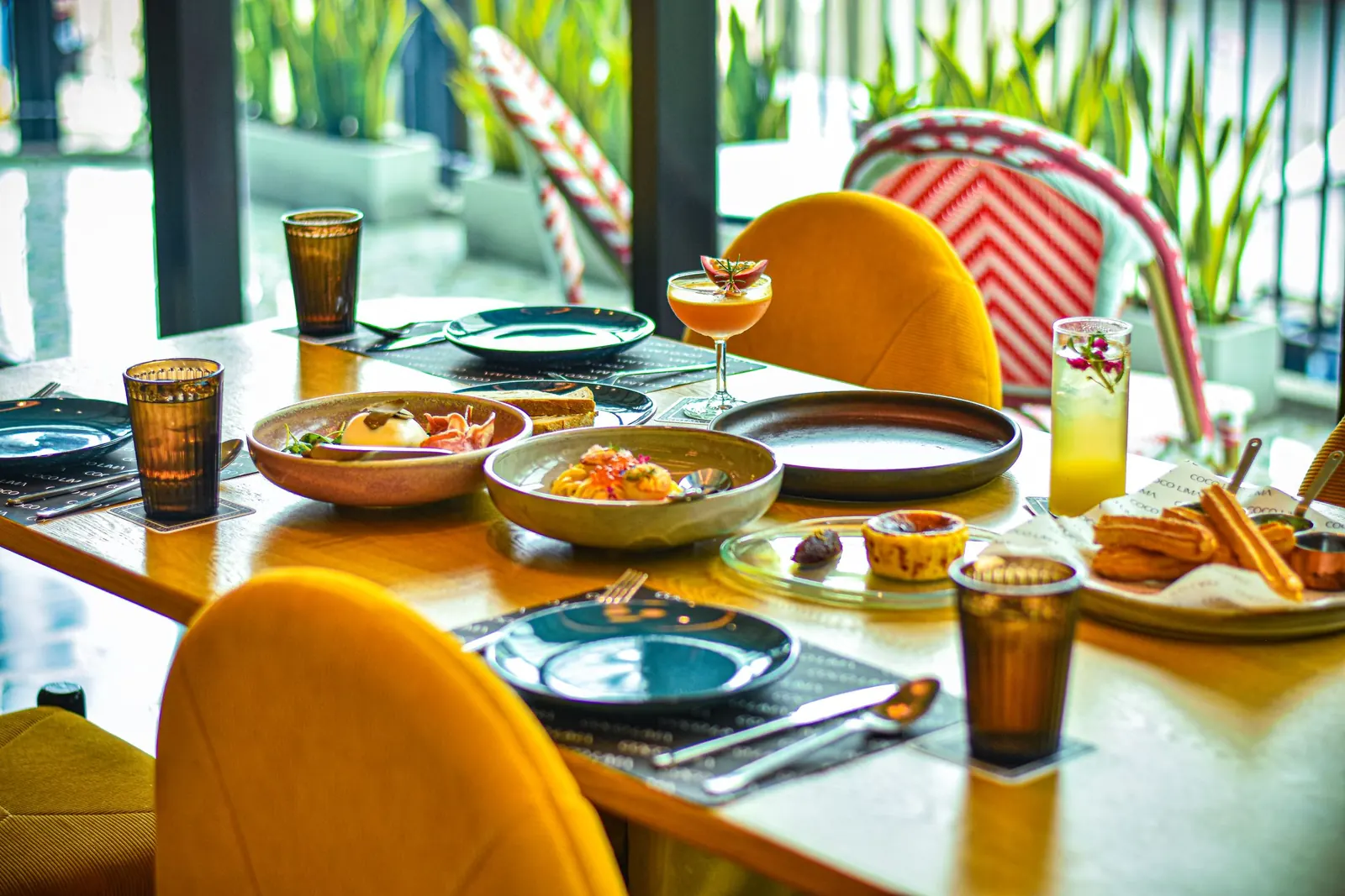 A warmly lit table set for a shared meal