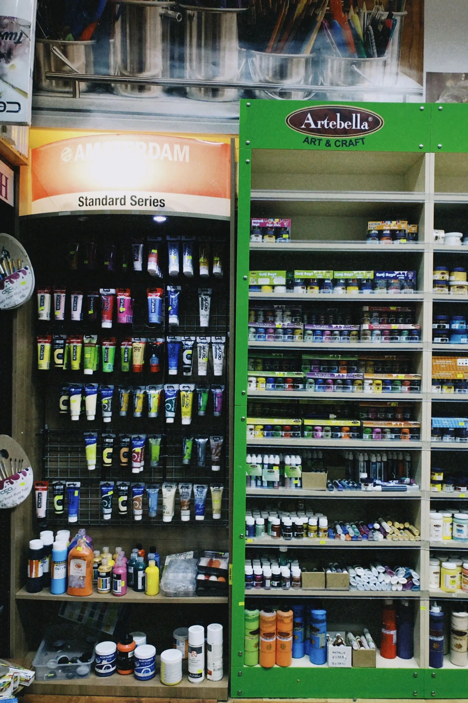 Colorful art materials arranged on studio shelves