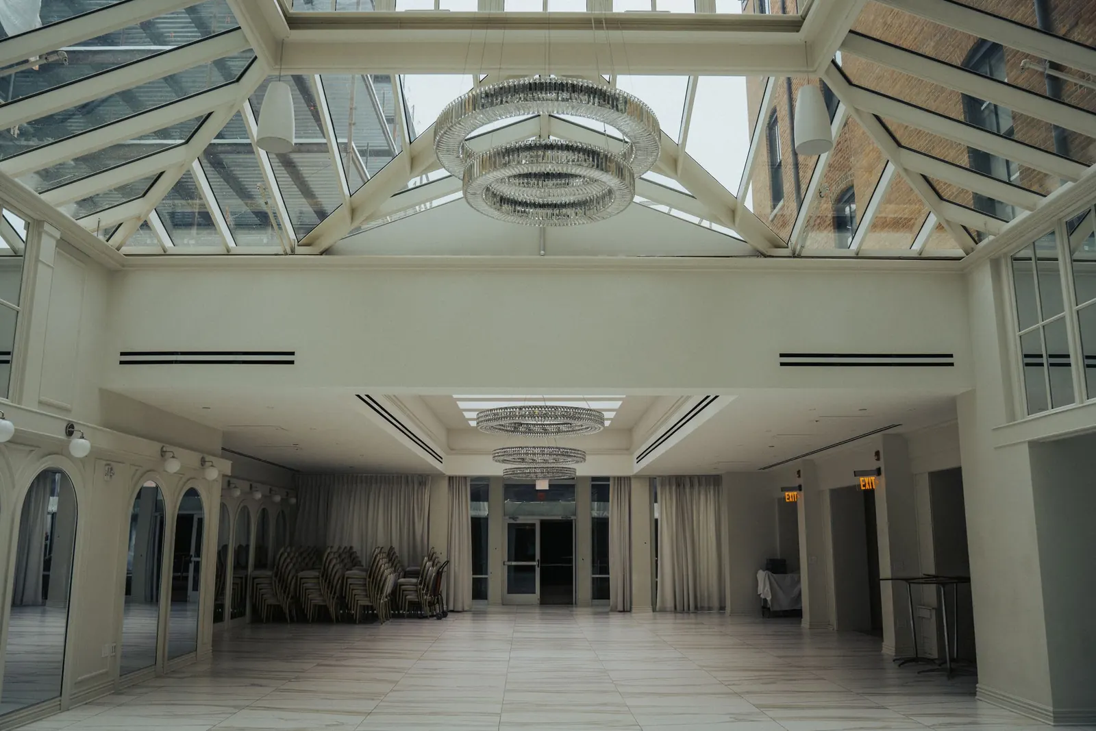 A light-filled hall under a glazed roof